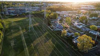 Aerial drone view of electrical wires in neighborhood